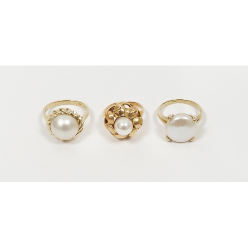 490 - 9K gold and half blister pearl ring (size P), a 14K gold and pearl stylised flowerhead ring (size J)... 