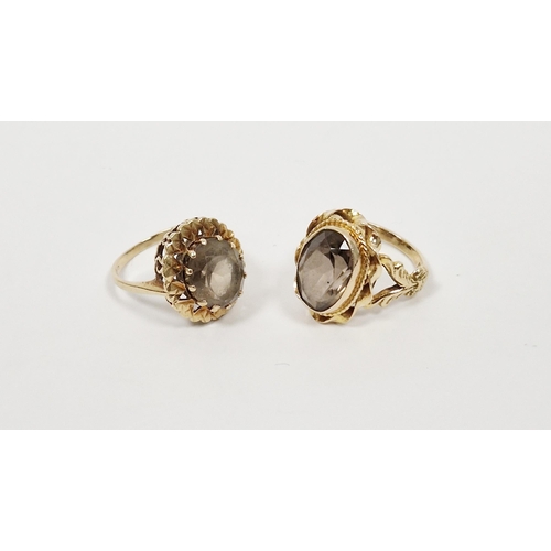 491 - 9ct gold smoky quartz ring, the oval cut stone in scroll mount (size P) and another gold and smoky q... 