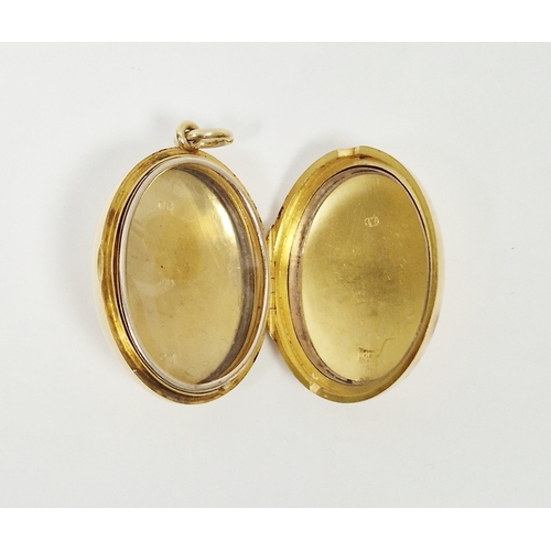 516 - 18ct gold plain oval locket, gross weight approx 31.8g