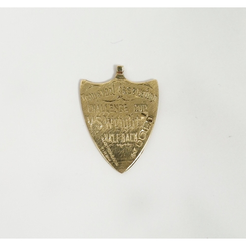 546 - Victorian gold shield-shaped pendant, rubbed hallmarks, presented as an award for the Transvaal Asso... 