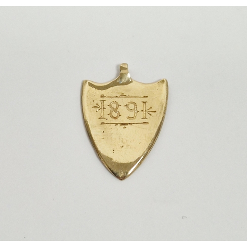 546 - Victorian gold shield-shaped pendant, rubbed hallmarks, presented as an award for the Transvaal Asso... 