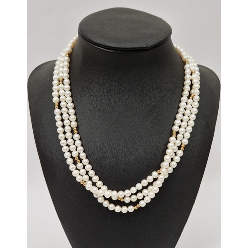 554 - Three-strand cultured pearl necklace, pearls of uniform size, 9k gold clasp stamped 375 and 9k gold ... 