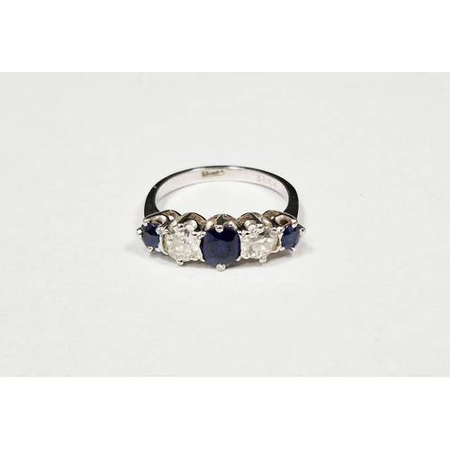 562 - Sapphire and diamond five stone platinum ring, three oval mixed cut sapphires, the central sapphire ... 