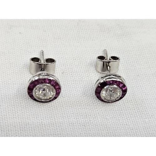 577 - Pair white gold-coloured metal, diamond and ruby stud earrings, each with diamond approx. 0.5ct surr... 