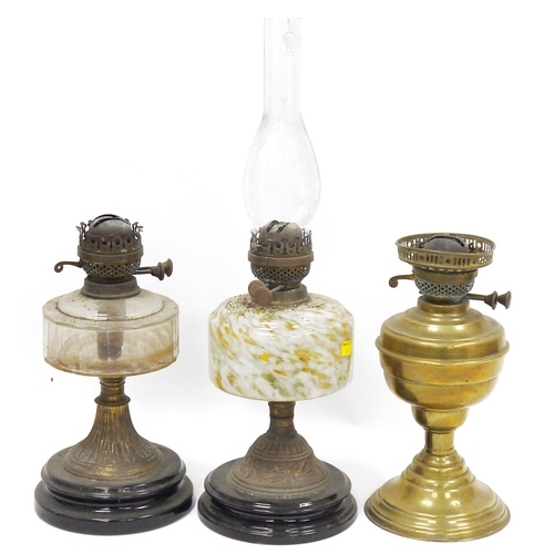 93 - Three Victorian oil lamps, one with mottled glass reservoir, another with faceted clear glass reserv... 