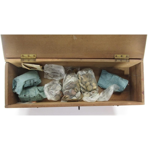 237 - A large mixture of British and world coins within wooden box consisting of Victorian bun pennies, br... 