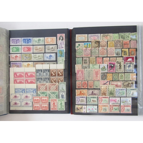 370 - British Empire Stamps: Two boxes of mostly mint and used definitives and commemoratives in 6 stock b... 