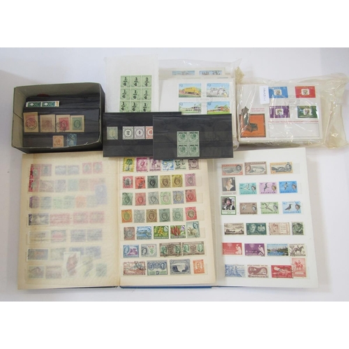 370 - British Empire Stamps: Two boxes of mostly mint and used definitives and commemoratives in 6 stock b... 