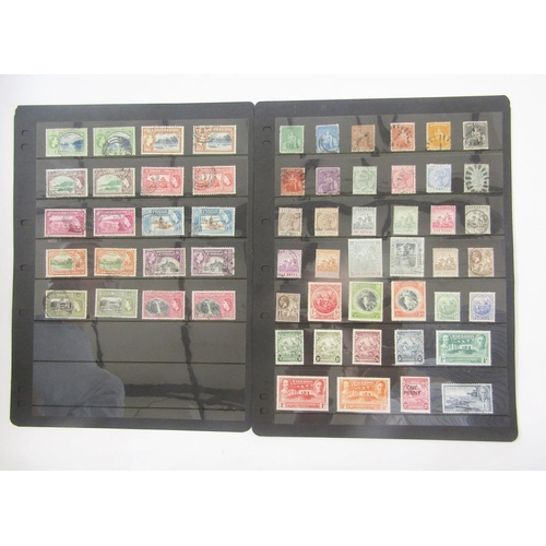 370 - British Empire Stamps: Two boxes of mostly mint and used definitives and commemoratives in 6 stock b... 