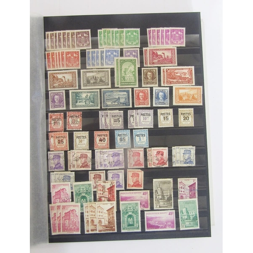 377 - Stamps of Albania, Algeria, Argentina, Monaco and San Marino: Four stock books including early issue... 