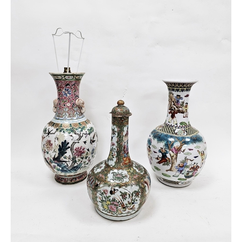 110 - Chinese Canton famille rose bottle vase and cover, 19th century, painted with figures in an interior... 