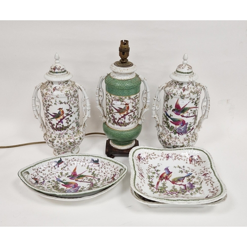 12 - Assorted continental porcelain Chelsea-style dinner wares, each printed with exotic birds in landsca... 