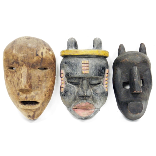 127 - Three large tribal ethnic carved wooden face masks, including Nepal shaman ritual mask, Bamana style... 