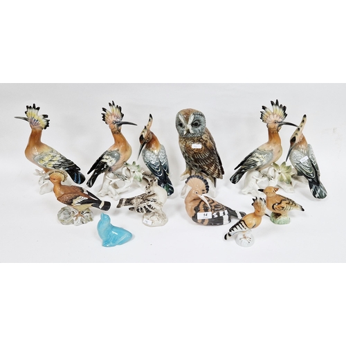 14 - Assorted English and continental pottery and porcelain models of birds, predominantly hoopoes includ... 