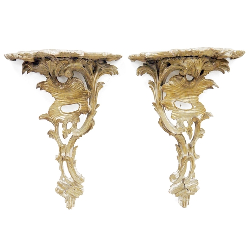 144 - Pair of carved wooden rococo style bracket shelves with foliate scroll decoration, 48cm high