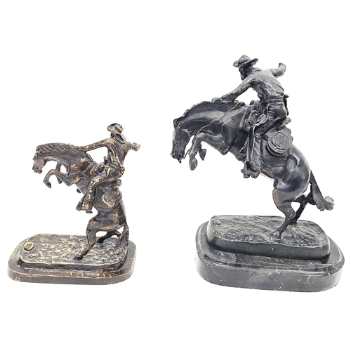 160 - After Frederick Remington, cast bronze model of the Bronco Buster raised on an oval black marble bas... 