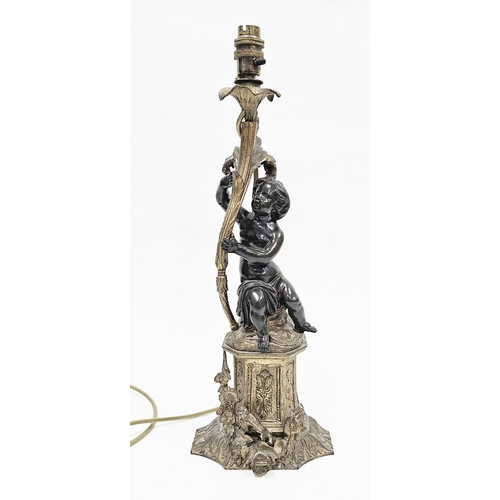 183 - Bronze figural table lamp in the form of a putto holding a foliate scrolling branch and raised on a ... 