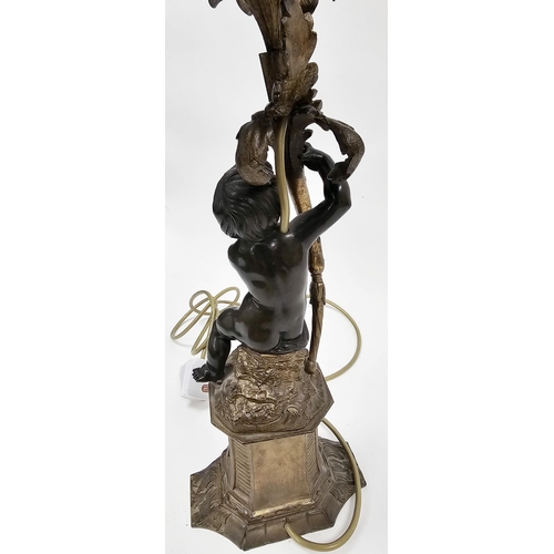 183 - Bronze figural table lamp in the form of a putto holding a foliate scrolling branch and raised on a ... 