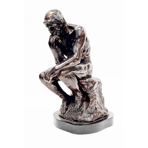 192 - After Auguste Rodin, cast bronze figure of ' The Thinker ' raised on a shaped black slate base, 38cm... 