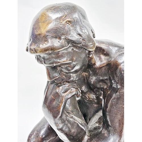 192 - After Auguste Rodin, cast bronze figure of ' The Thinker ' raised on a shaped black slate base, 38cm... 