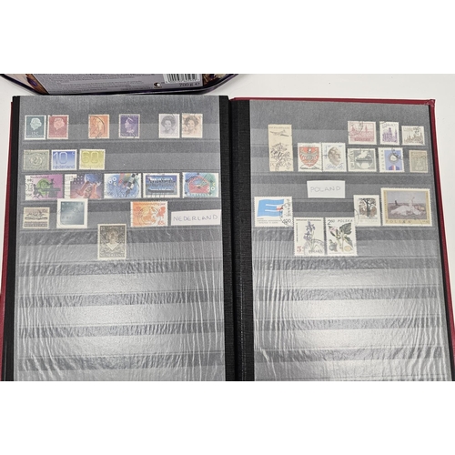 248 - Collection of stamps, first day covers and stamps on paper including two stamp albums partially fill... 