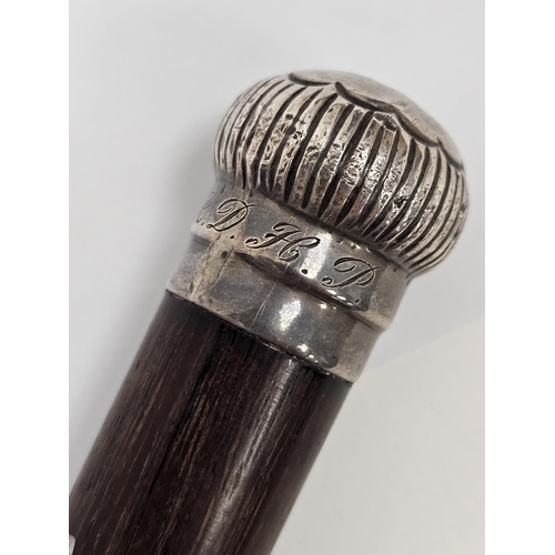 297 - Victorian rosewood walking stick with silver fluted pommel, London 1899, James Oliver, 90.5cm long