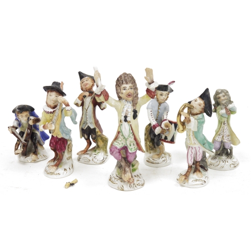 67 - Continental porcelain seven piece monkey band, circa 1900, comprising: a conductor and six monkey mu... 