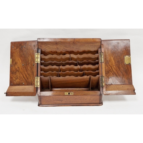 1006 - Late Victorian walnut stationery cabinet, the sloping twin doors opening to a fitted stationery rack... 