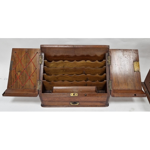 1011 - Edwardian oak tantalus, brass-mounted with hinged foliate carved front flaps opening to reveal compa... 