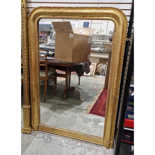 1334 - 19th century gilt overmantel mirror, the frame with rounded top corners and moulded decoration of fo... 