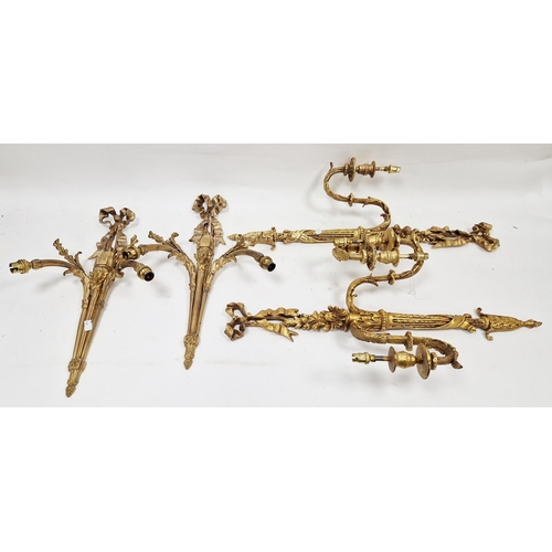 1345 - Pair of gilt metal double branch wall lights in the French Louis XVI manner, with ribbon cresting an... 