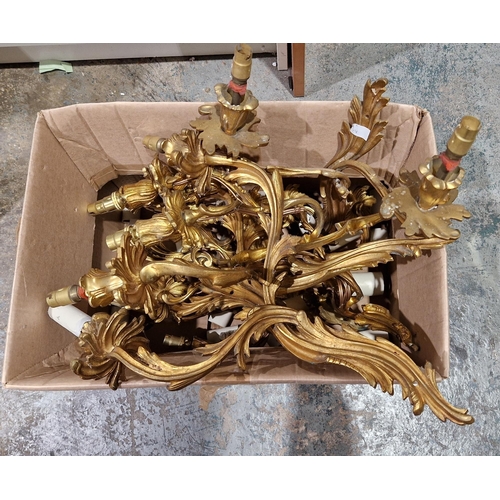 1346 - Set of four gilt metal three-branch foliate scroll wall light fittings in the rococo manner, 38cm hi... 