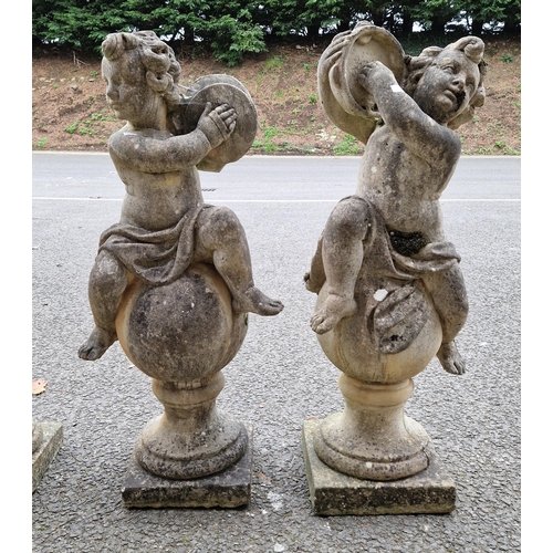 1351 - Set of four composite stone garden statues in the form of musical putti playing tambourine, mandolin... 