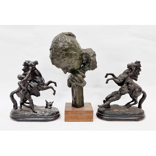 162 - Two late 19th/early 20th century black painted cast metal equestrian groups of a groom and stallion,... 