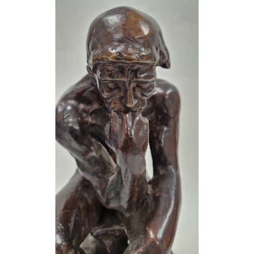 163 - After Auguste Rodin, cast bronze figure of ' The Thinker ' raised on a shaped black slate base, 38cm... 