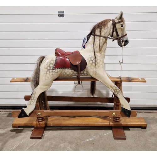 569 - Wooden painted dapple grey rocking horse with horse hair mane and tail and leather bridle and saddle... 