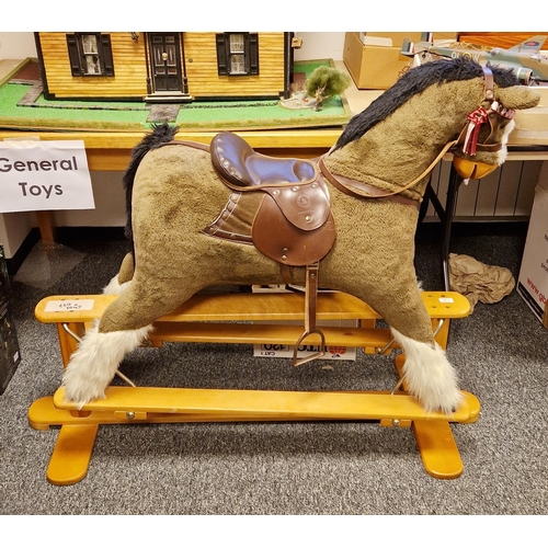 573 - Mamas and Papas ' Rocking Horse collection ' bay rocking horse with leather bridle and saddle, held ... 