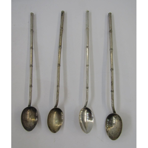 307 - Four Chinese silver coloured metal bamboo effect straw pattern spoons