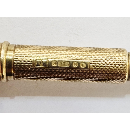 321 - 9ct gold retractable cigar piercer of trumpet design with engine turned decoration, approx 11g, appr... 