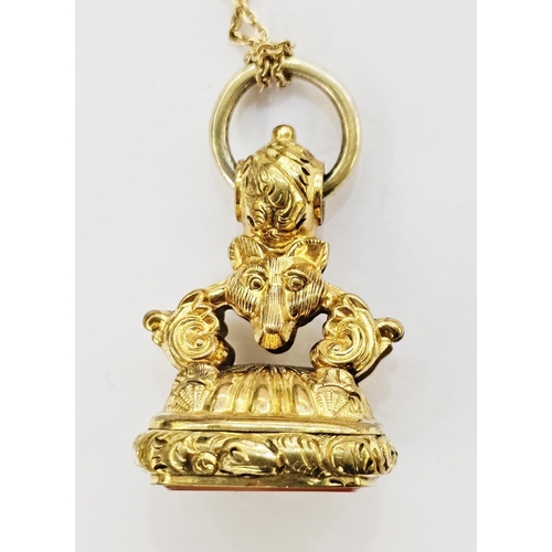 324 - Victorian gilt metal fob seal of ornate design with a fox's head and foliate scrolls, the agate tabl... 