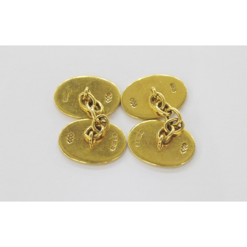 369 - Pair of 18ct gold cufflinks of oval form, enamelled with a bassett hound in a garden, with chain lin... 