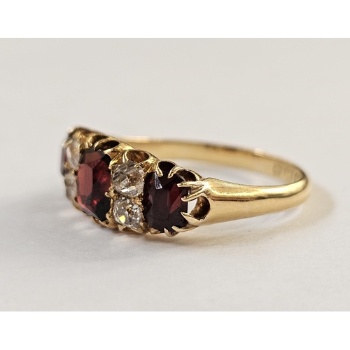 500 - 18ct gold, garnet and diamond ring, the three graduated mix cut garnets interspersed by two pairs of... 