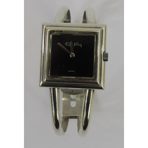 599 - Lady's silver Roy King bracelet watch, London 1973, the square black dial with signature, on bangle ... 