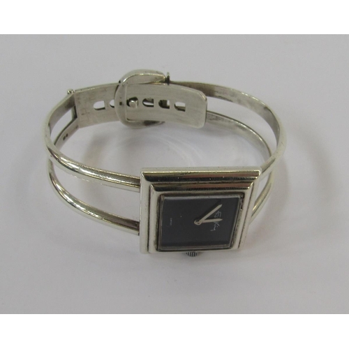 599 - Lady's silver Roy King bracelet watch, London 1973, the square black dial with signature, on bangle ... 