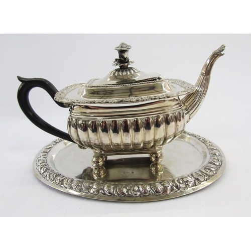 283 - Silver plate teapot in the George III manner of rectangular squat form with flower finial, scrolling... 