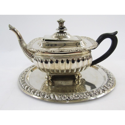 283 - Silver plate teapot in the George III manner of rectangular squat form with flower finial, scrolling... 