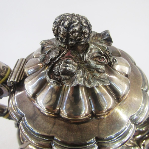 296 - William IV silver coffee pot, baluster shape and panelled with melon and foliate finial, scroll hand... 