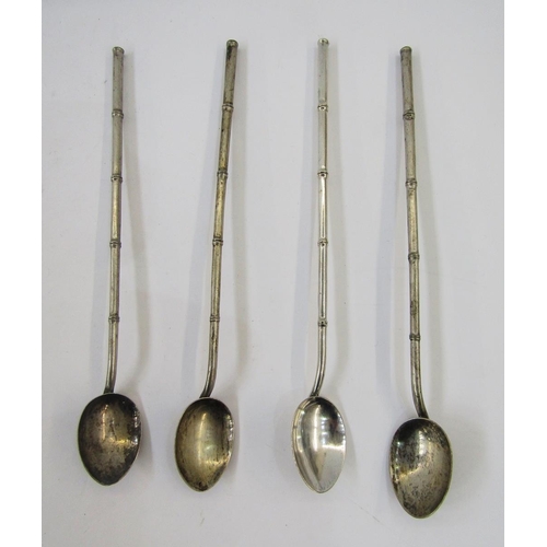 307 - Four Chinese silver coloured metal bamboo effect straw pattern spoons