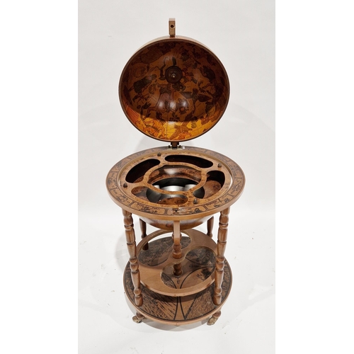 1053 - 20th century Italian style terrestrial globe cocktail cabinet, the hinged lid opening to a fitted in... 