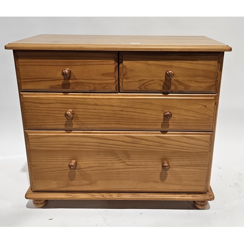 1064 - Modern pine chest of two short over two long drawers, on bun feet, 71cm high x 82cm wide x 40cm deep